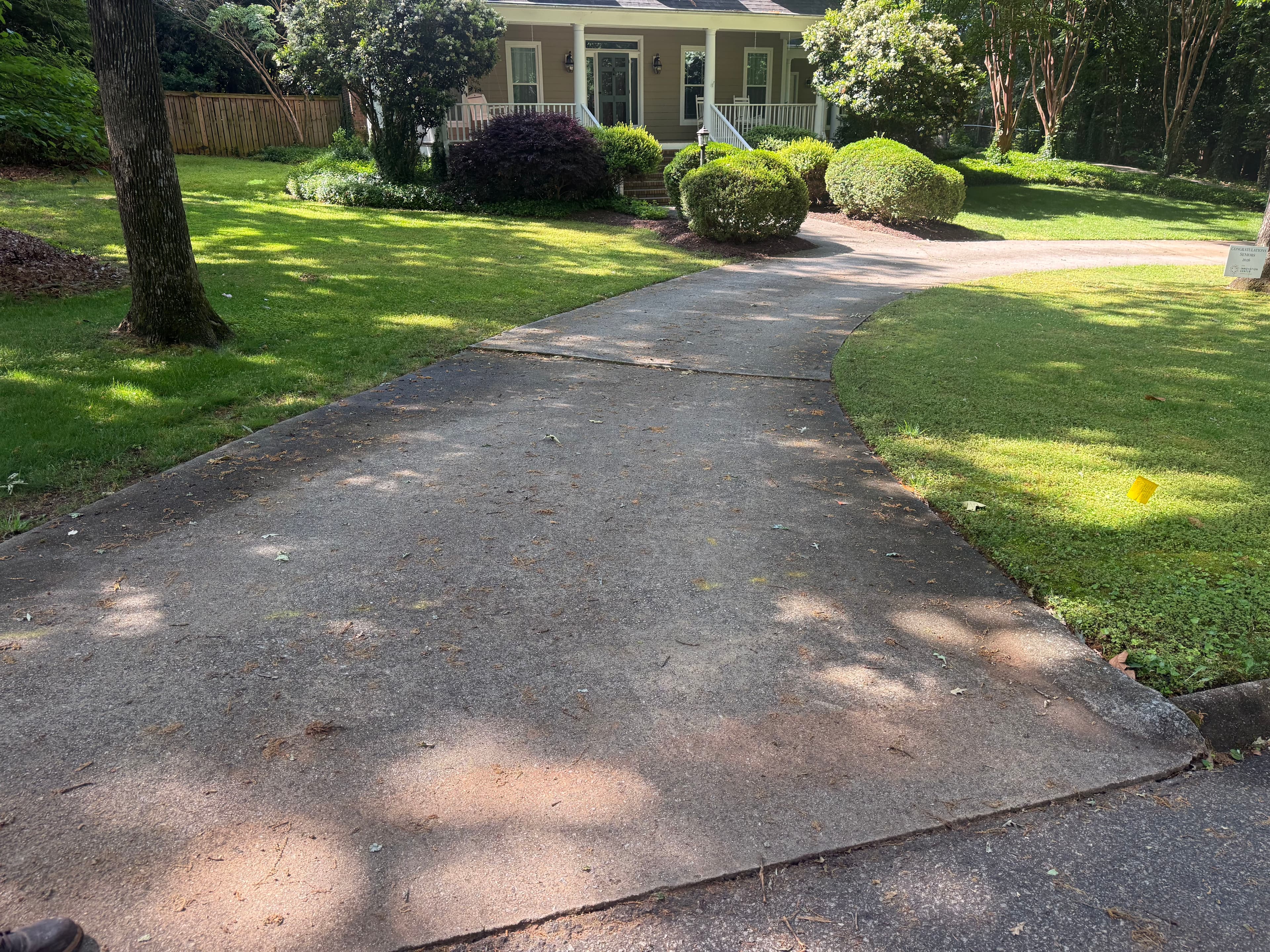 Project Driveway and Brick Patio Pressure Washing Before and After image