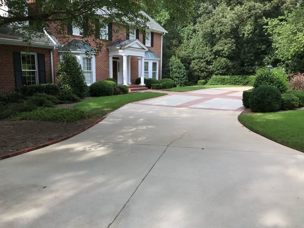 Project Driveway and Walkway Pressure Washing for Elegant Red-Brick Home image