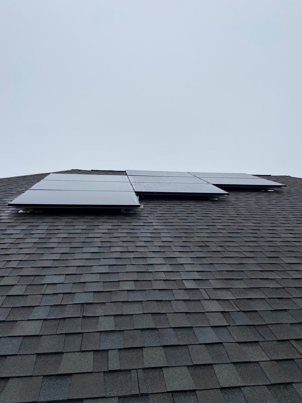 Solar panels installed on a sloped roof, showcasing eco-friendly energy solution.